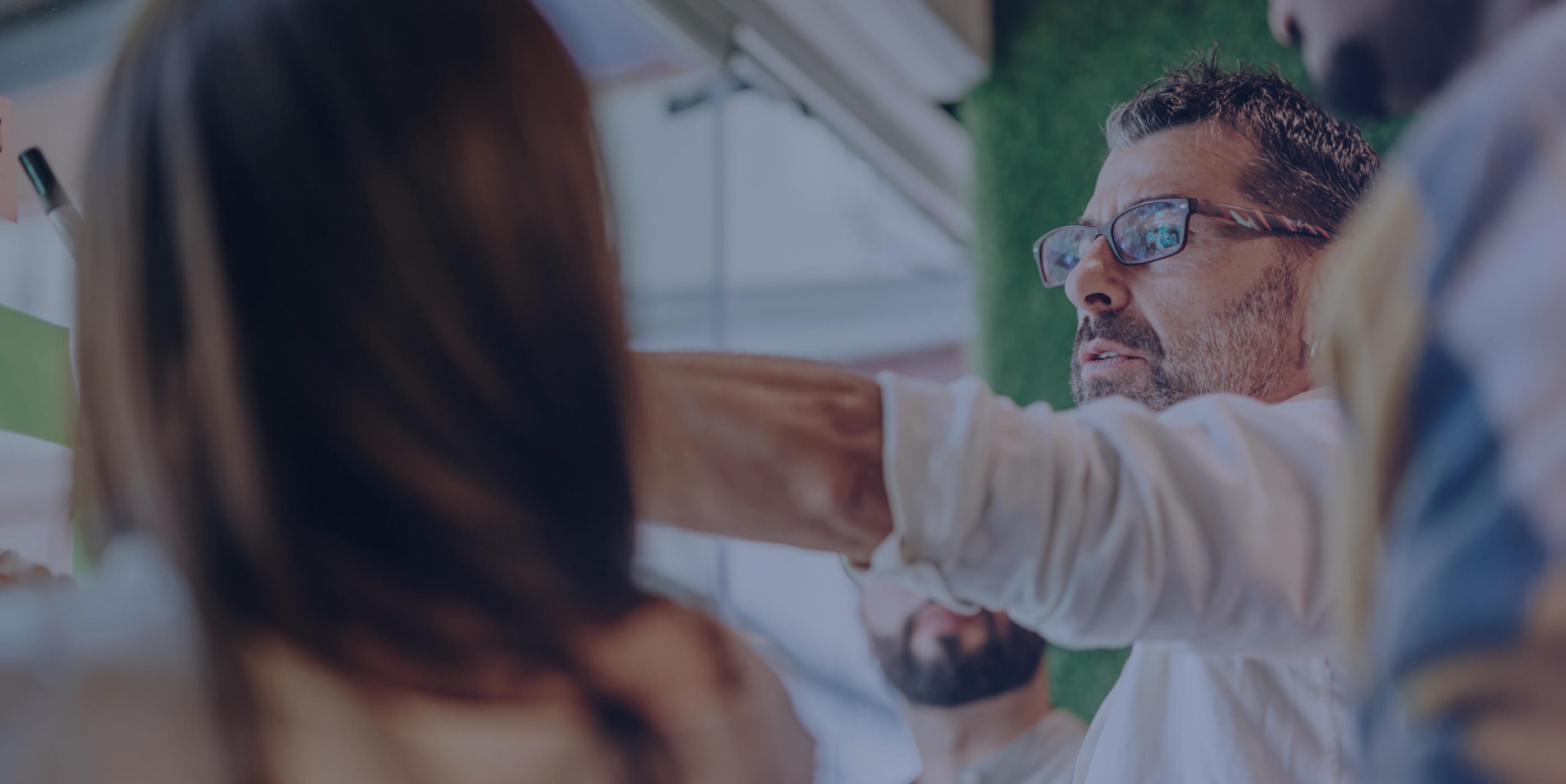 Man pointing to a whiteboard